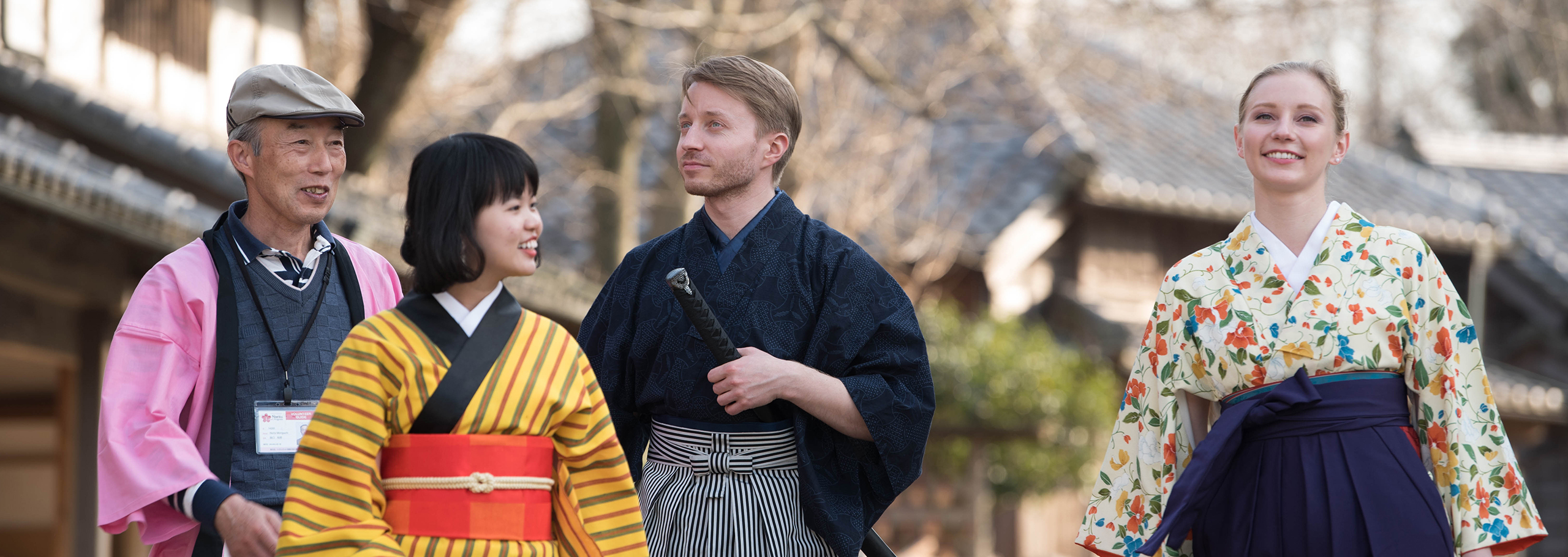 Visitors dressed in kimono and samurai attire in Sakae Town