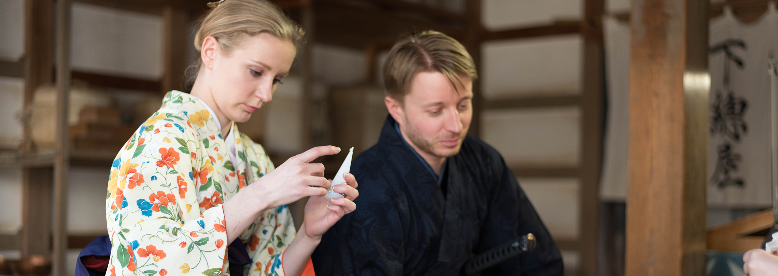 Visitors wearing kimono and samurai attire during a cultural experience in Sakae Town